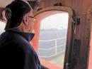 3Y0Z co-leader Ralph Fedor, K0IR, looks out at Bouvet Island from the MV Betanzos.